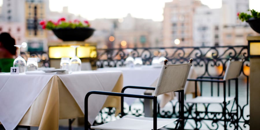 Empty chair in a restaurant on the main square of town